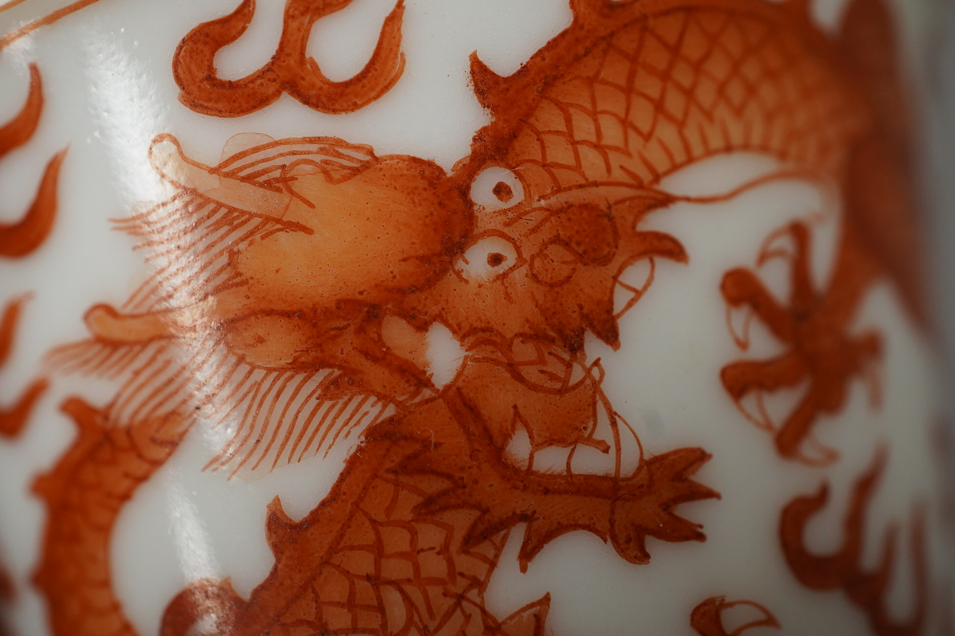 A pair of Chinese iron red ‘dragon’ cups, Guangxu six character mark and probably of the period (1875-1908)